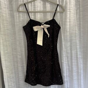 Divided Black Sequin Mini Dress with White Bow